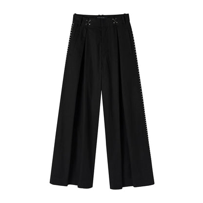 Pantalon à jambes larges plissées brodées