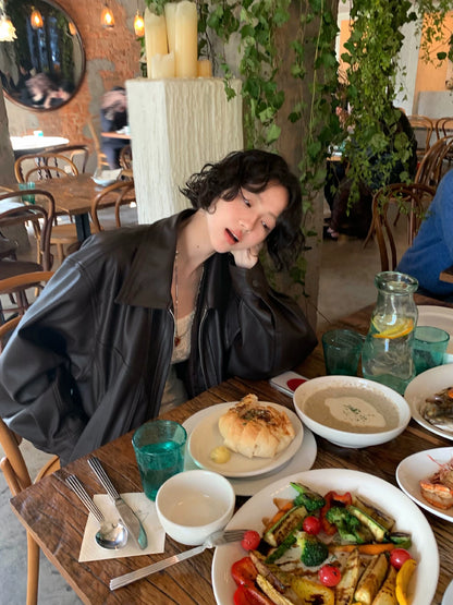 Wine afternoon elegant retro 2026 spring lapel dropped shoulder sleeve PU leather jacket loose short windproof design jacket for women
